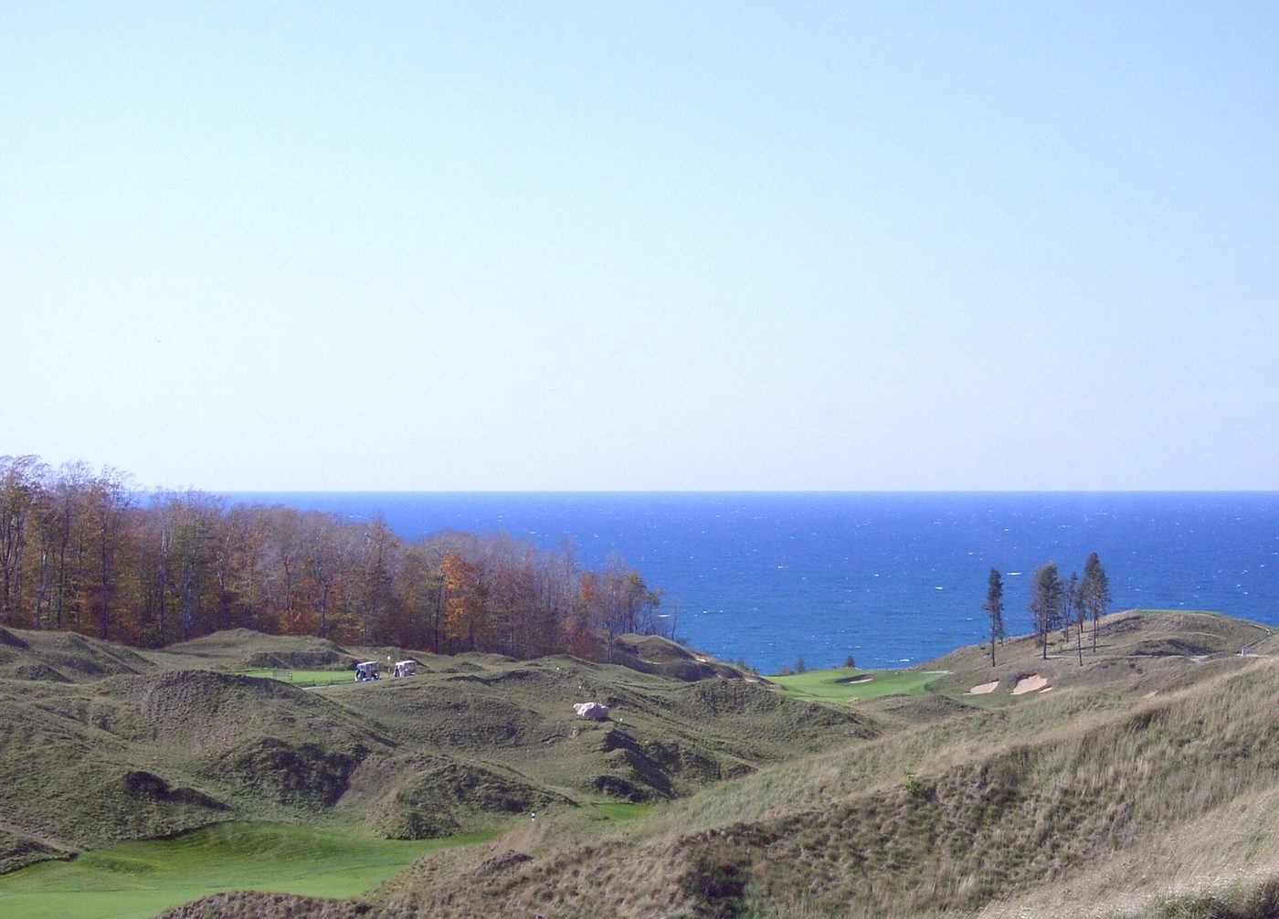 The 10th and 11th holes at Arcadia Bluffs among grassy dunes above Lake Michigan in autumn