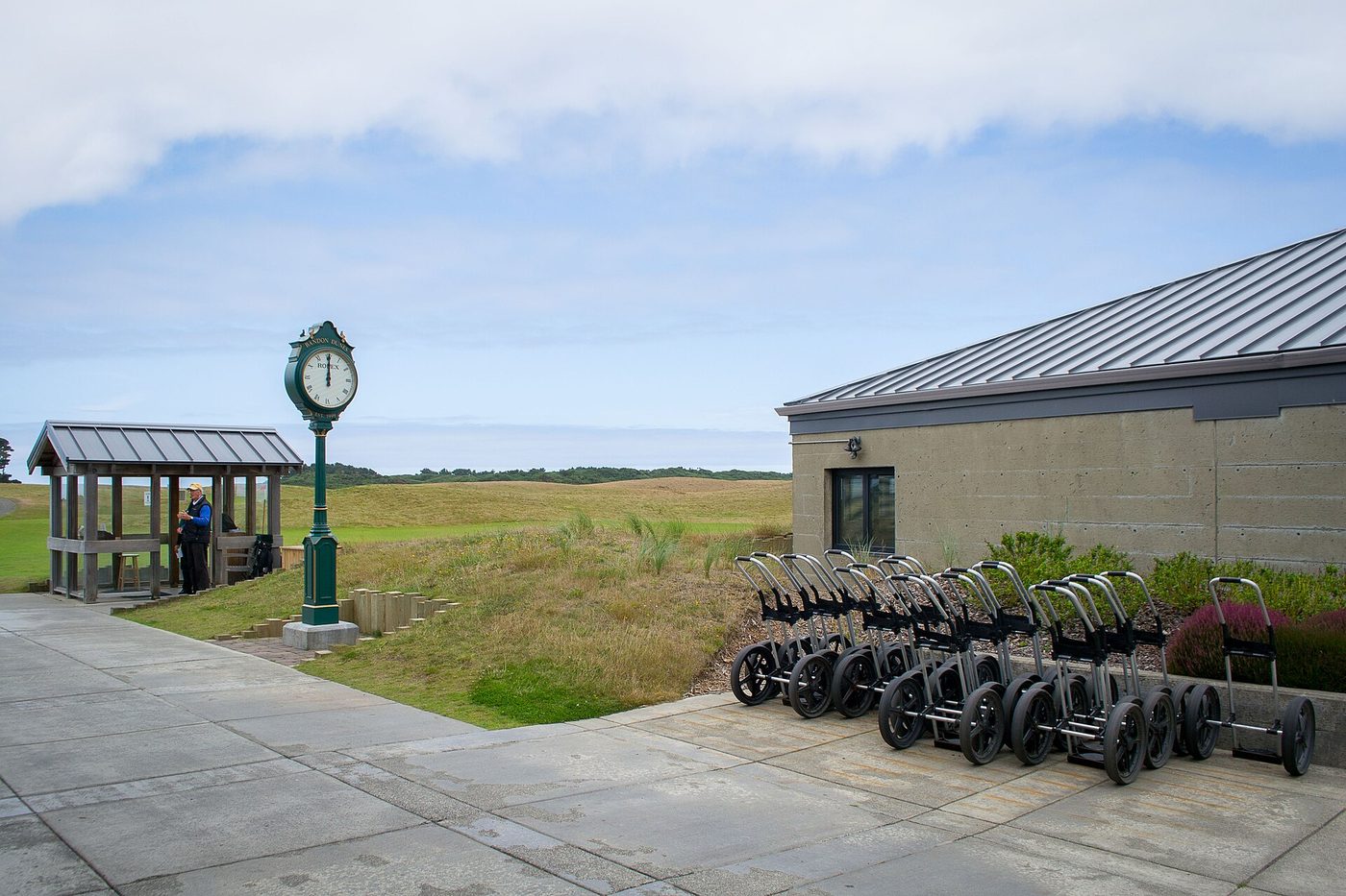 Rows of push carts and the starter's clock at Bandon Dunes Golf Resort, where every course is walking only