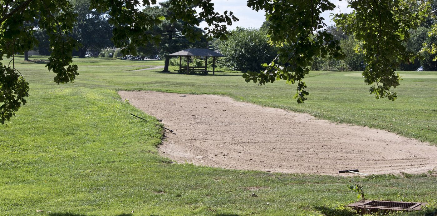 A raked sand bunker in the middle of a fairway on the White Course at East Potomac Golf Course in Washington, D.C.