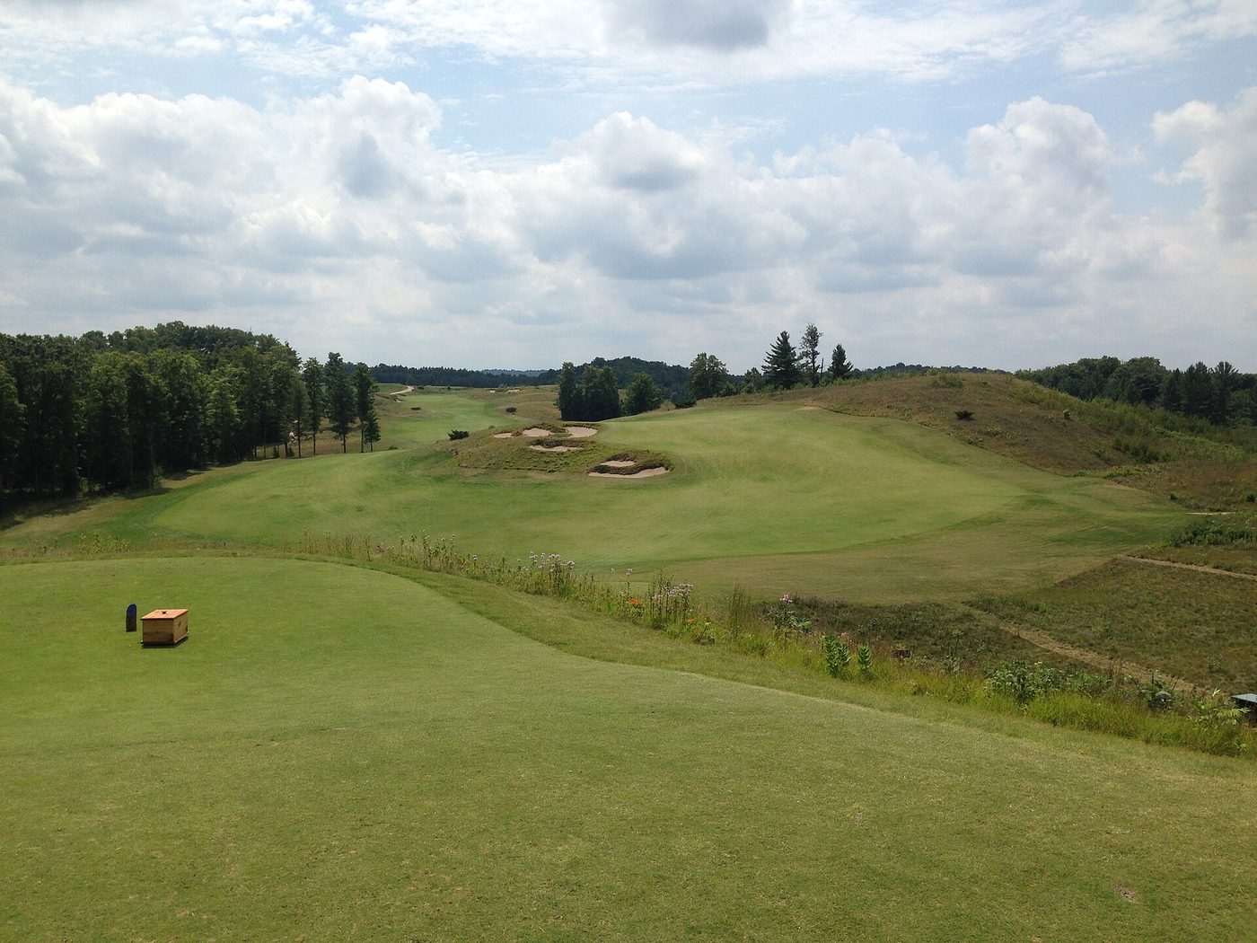 The first tee at the Kingsley Club in Michigan, with a box of seed for repairing divots beside the tee markers