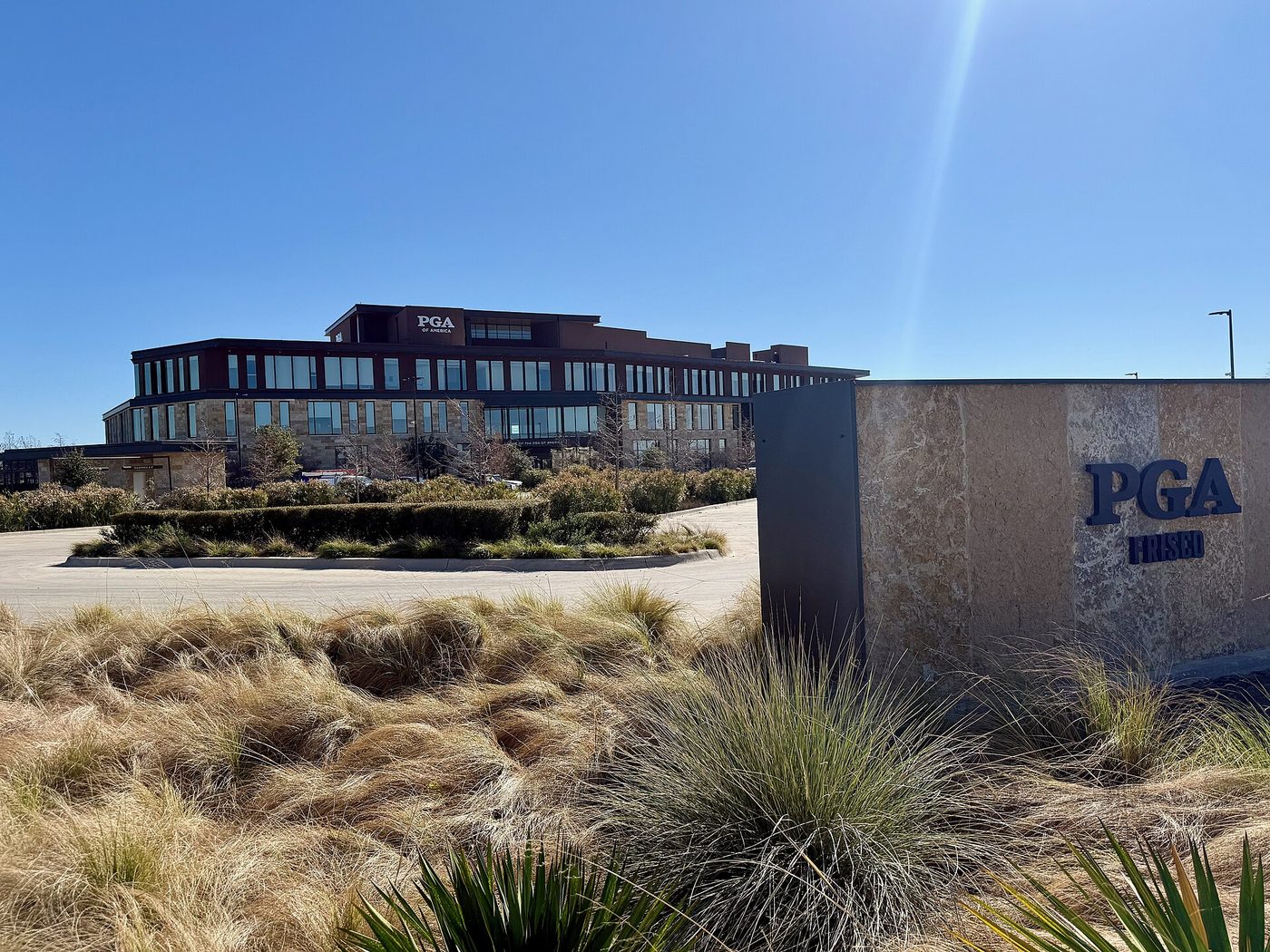 The PGA of America headquarters building at PGA Frisco in Frisco, Texas, with native grasses in front