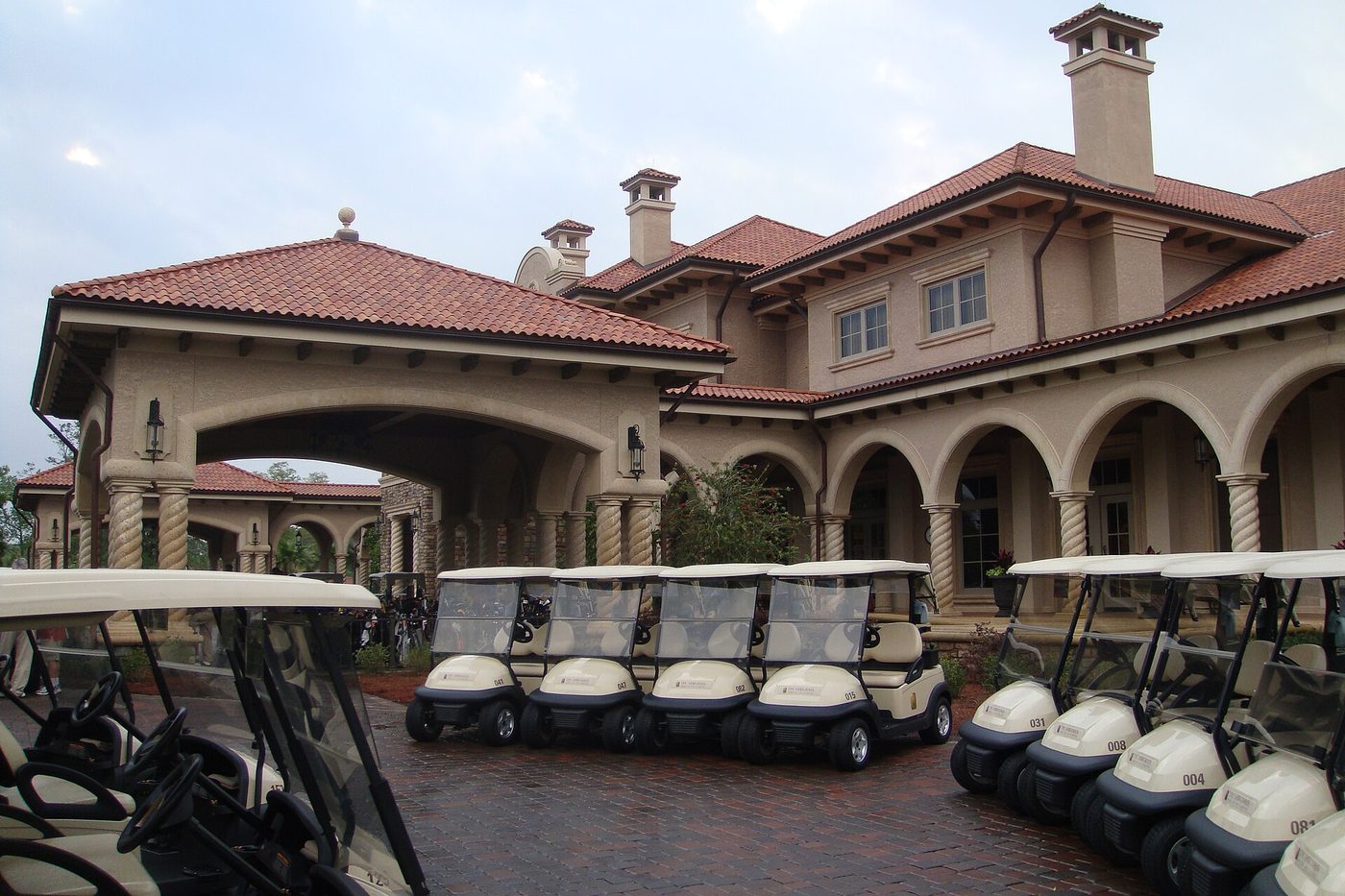 Golf carts lined up outside the Mediterranean-style clubhouse at TPC Sawgrass in Ponte Vedra Beach