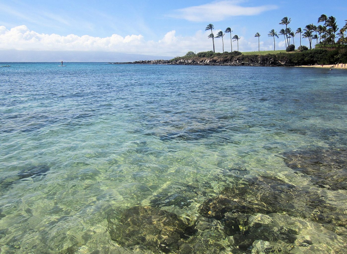Clear turquoise water over rocks in Kapalua Bay on Maui's north-west shore