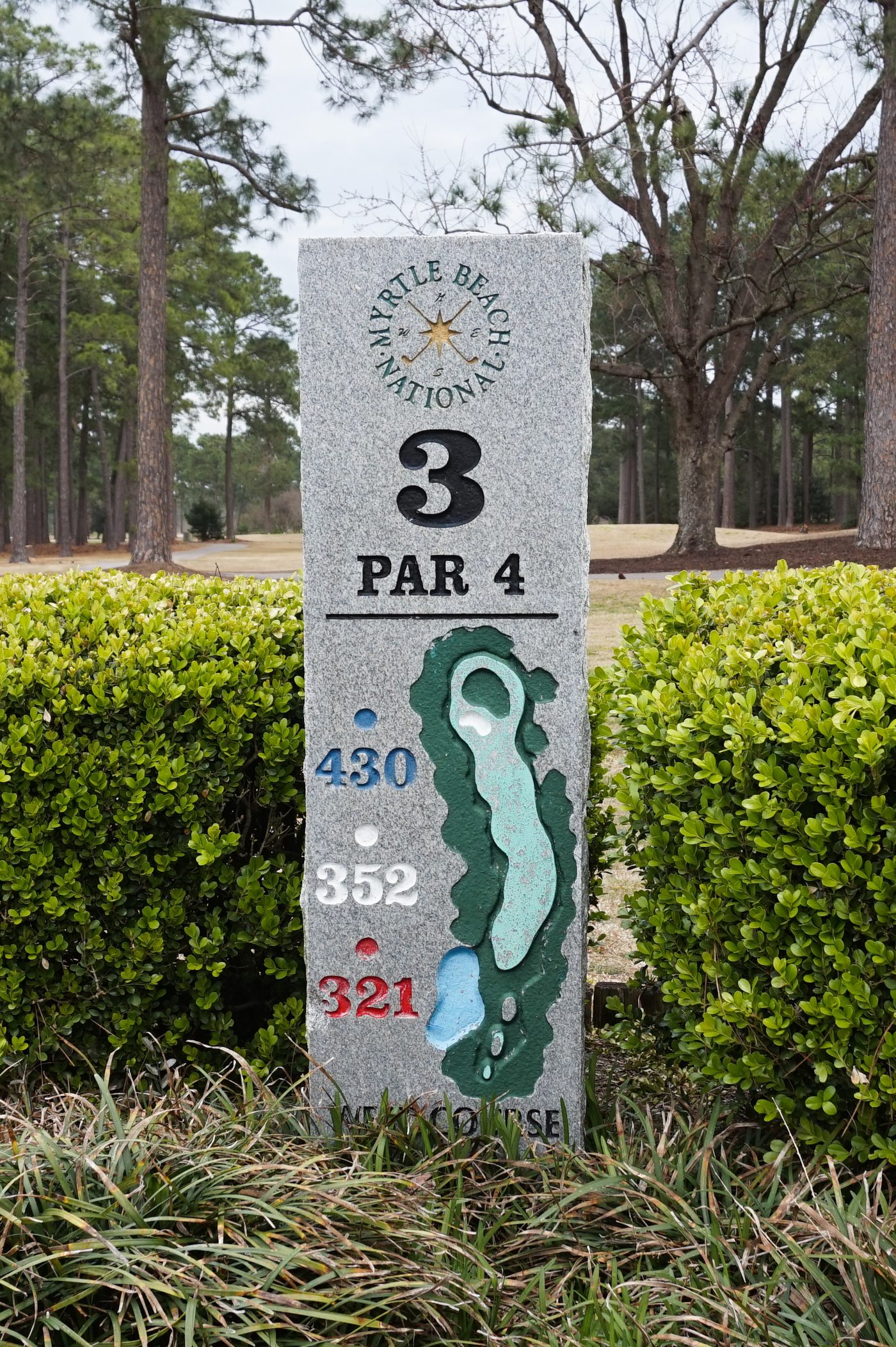 The granite marker for the par-4 3rd hole on the West Course at Myrtle Beach National, showing a hole map and yardages of 430, 352 and 321