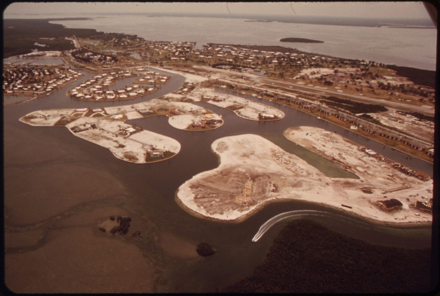 Aerial view of canal-front homesites being cut from the mangroves at the Ocean Reef Club on North Key Largo in the 1970s