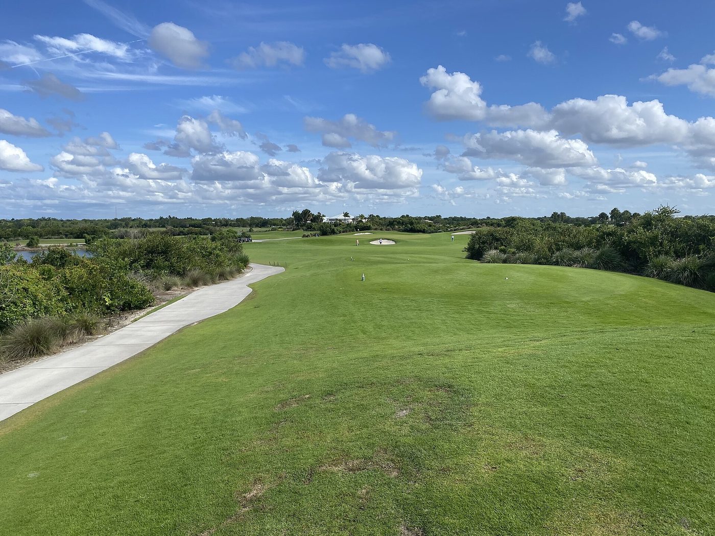 A wide fairway with bunkers and a cart path at Osprey Point, Palm Beach County's public golf course in west Boca Raton