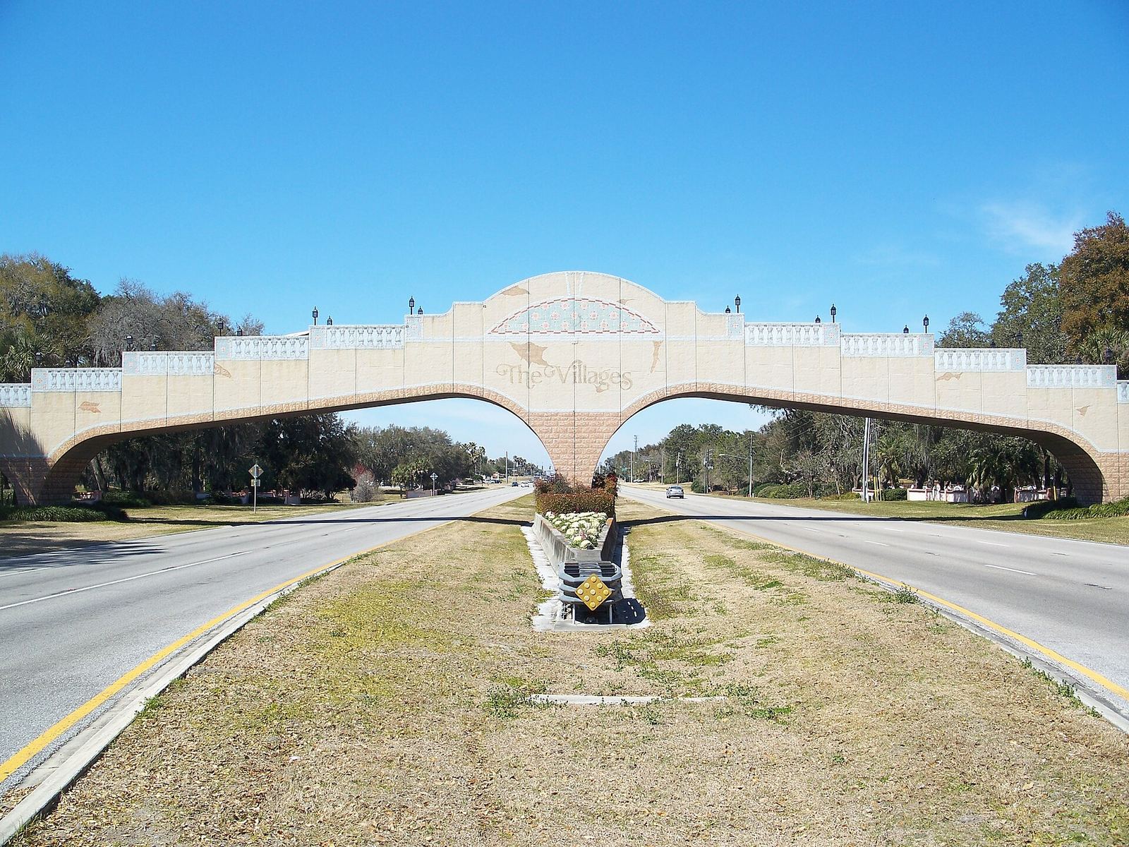 The arched golf-cart bridge over US 27/441 in The Villages, the best value among the best golf communities in Florida