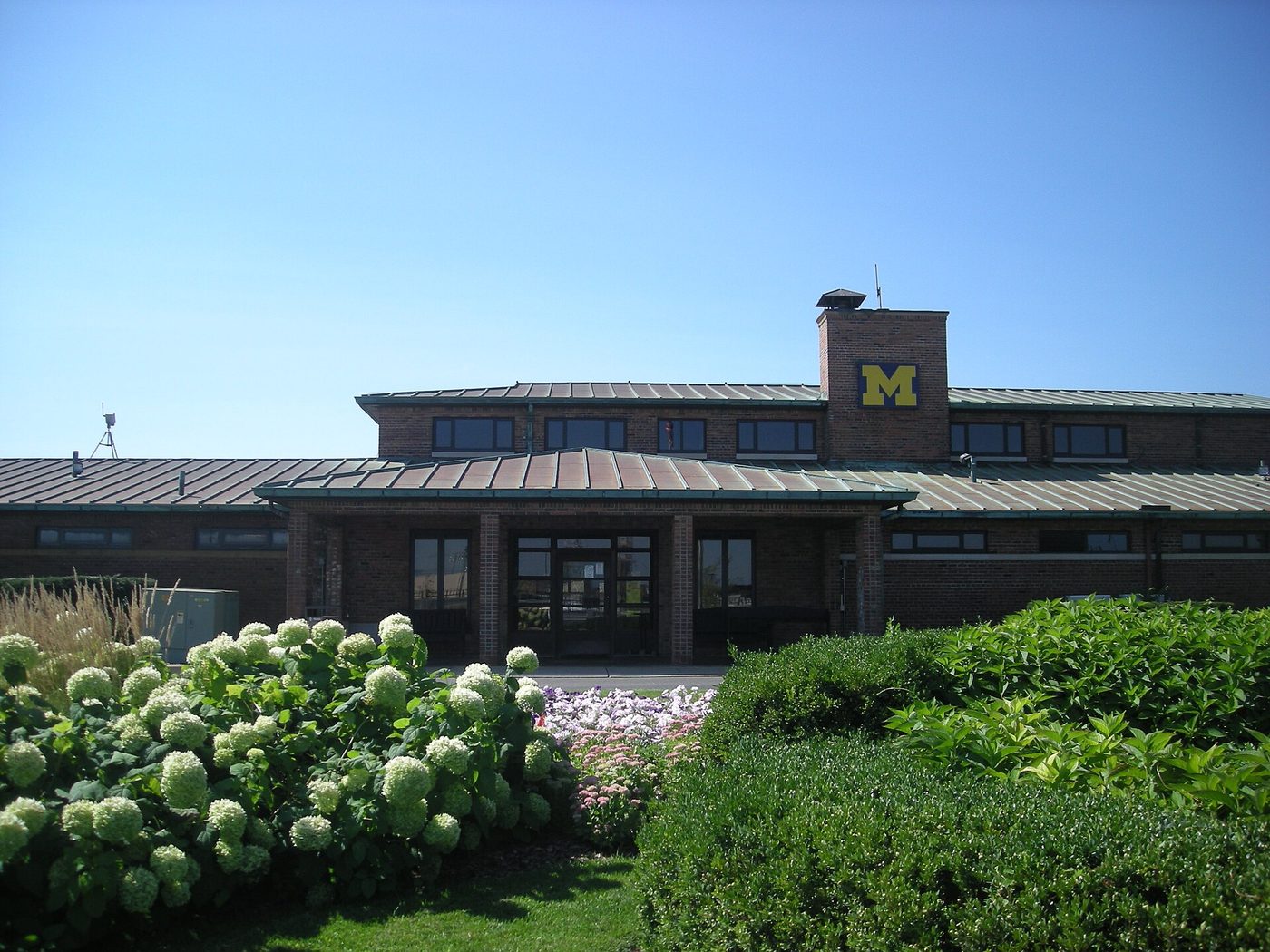 The brick clubhouse with a block M at the University of Michigan Golf Course in Ann Arbor
