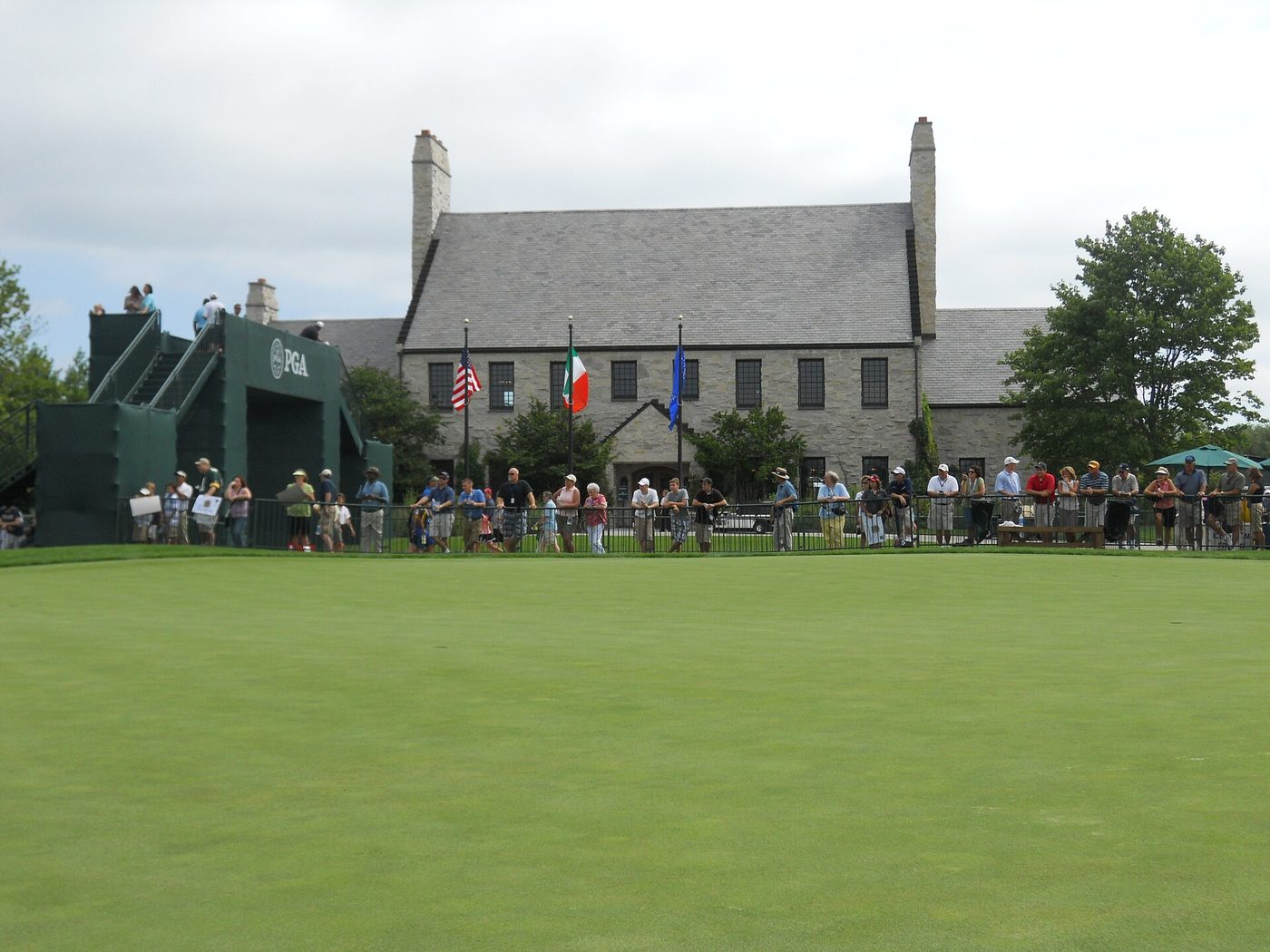 Spectators lining the 18th green in front of the stone clubhouse at Whistling Straits during the 2010 PGA Championship